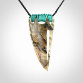 This picture shows a Labradorite stone drop pendant that we have hand carved.